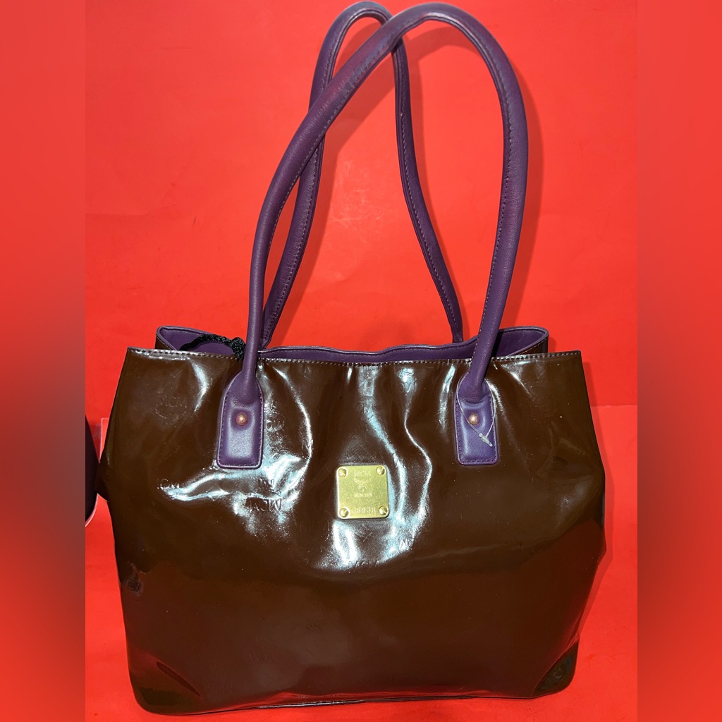 Mcm Patent Leather Embossed Tote In Dark Brown With Purple Handles And Interior